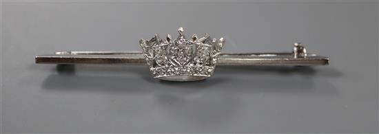 A mid 20th century white metal and diamond set coronet bar brooch, 56mm, gross 5 grams.